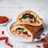 Chicken Rockefeller Calzone · Chicken, spinach, blue cheese, sundried tomatoes, bacon, and mozzarella. Served with choice ...