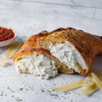 Cheezy Calzone · Mozzarella, provolone, Monterey jack, and ricotta cheese. Served with choice of dipping sauce.
