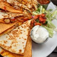 Quesadillas · Your choice of chicken or veggie. Grilled flour tortilla, peppers, onions, melted Monterey a...
