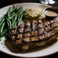 Ribeye · 14 oz. hand-cut, charbroiled. Served with our signature zip sauce.