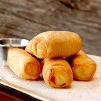 Tequeños (Appetizer) · Five fried white cheese sticks wrapped in wheat flour dough, served with cilantro aioli sauce.