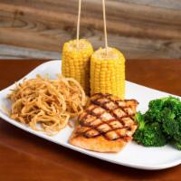 Grilled Salmon · Delicious Grilled Salmon fillet (8 oz). Served with two sides and garnished with Yuca Fries ...
