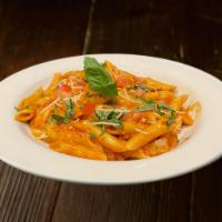 Penne Vodka & Salmon · Fresh salmon sautéed in shallots, diced tomatoes and a pink sauce tossed with penne pasta. 