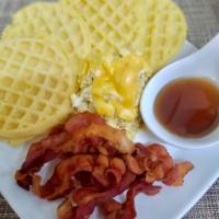 Waffles · 2 eggs and choice of meat (sausage, bacon or ham).