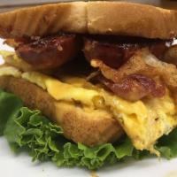 Breakfast Sandwich · 2 eggs and cheese with choice of meat (sausage, bacon or ham).