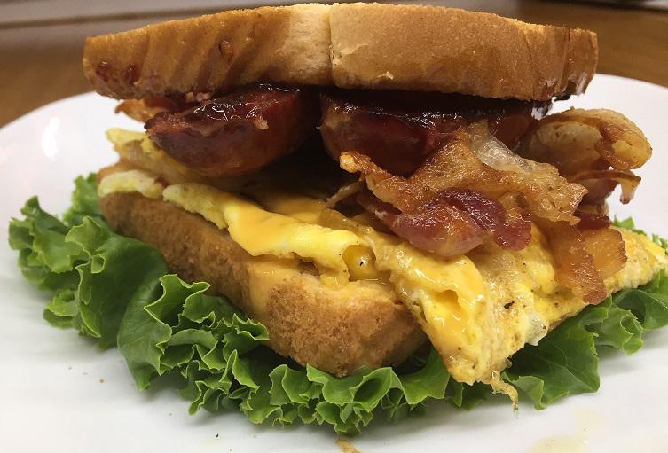 Breakfast Sandwich · 2 eggs and cheese with choice of meat (sausage, bacon or ham).
