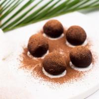 Chocolate Truffles  · Coconut Oil, Honey, Almond Butter, Cacao
Powder, Himalayan Salt
