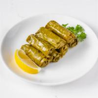 Dolmades · Grape leaves filled with ground beef and rice..... 7 pieces.