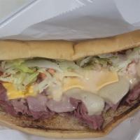 Corn Beef Sub · Grilled Corn Beef Cheese lettuce, tomatoes, Russian dressing on grilled buttery Sub roll