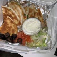 Quesadilla · Steak, chicken, shrimp or vegetarian. Cheese and pico de gallo, black olives. Served with le...