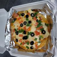 Mexican Pizza · jack cheese, cheddar cheese,  8inch fried tortillas, refried beans, red sauce cilantro, gree...