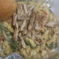Chicken Alfredo · Grilled or fried chicken sliced over pasta, Alfredo sauce red peppers and onions, parmesan c...