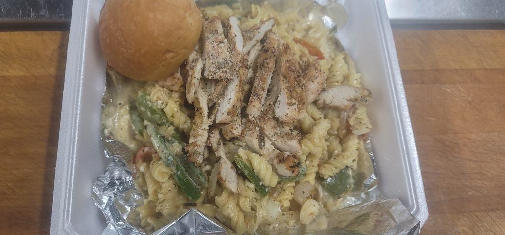 Chicken Alfredo · Grilled or fried chicken sliced over pasta, Alfredo sauce red peppers and onions, parmesan cheese. Served with a house salad and garlic bread.