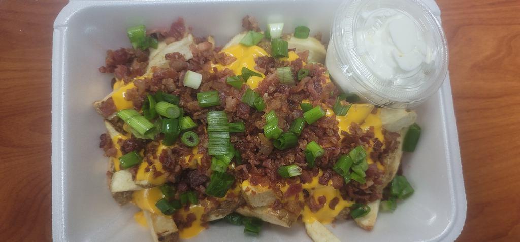44. Loaded Fries · Fresh cut fries, chesse, bacon, sour cream, green onions