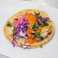 Pesaco Taco · Mahi mahi. red cabbage, pickled red onions, cilantro and lime chipitle crema.