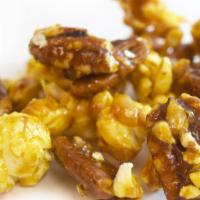 Toffee Pecan Popcorn  · Caramel popcorn mixed with a toffee flavored pecan.