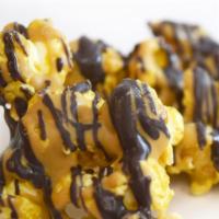 Peanut Butter Cup Popcorn · Caramel popcorn with peanut butter and dark chocolate drizzle.