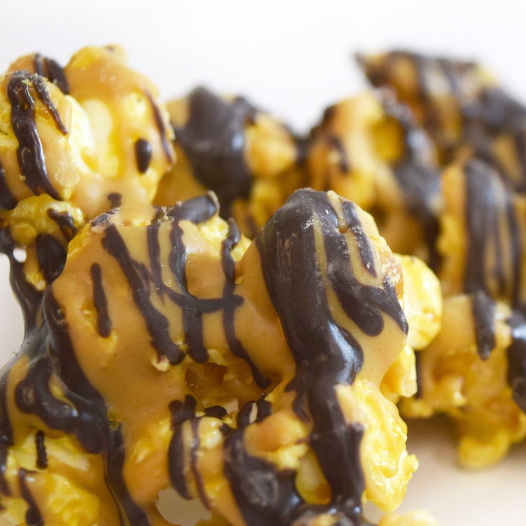Peanut Butter Cup Popcorn · Caramel popcorn with peanut butter and dark chocolate drizzle.