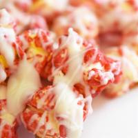 Strawberries and Cream Popcorn · Strawberry popcorn drizzled with white chocolate.