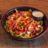 BBQ Chicken Salad · House salad blend, grilled chicken breast, BBQ sauce, corn relish, shredded cheese, and tort...