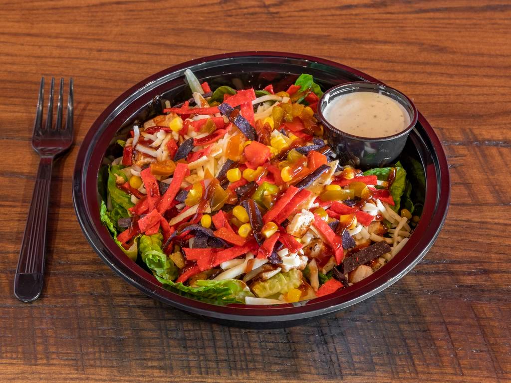 BBQ Chicken Salad · House salad blend, grilled chicken breast, BBQ sauce, corn relish, shredded cheese, and tortilla strips with your choice of dressing.