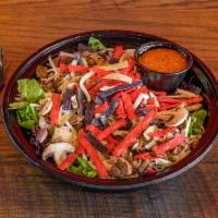 Steak Salad · House salad blend, grilled steak, mushrooms, shredded cheese, and tortilla strips with your ...