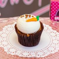 Carrot Cake · Carrot cake cupcake topped with cream cheese frosting.