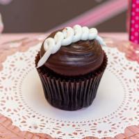 Chocolate Cream Cupcake · Chocolate cupcake filled with vanilla buttercream and topped with fudge icing.