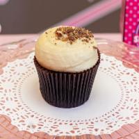 Peanut Butter Cupcake · Chocolate cupcake topped with peanut butter cream cheese and Reese's cup pieces.