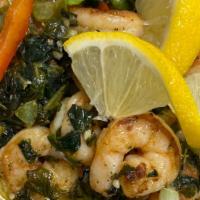 Cajun Shrimp ＆ Grits Bowl · Stoned ground grits topped with grilled shrimp tossed in a cajun butter garlic with green pe...