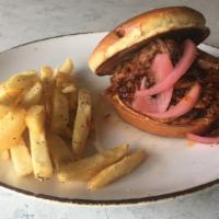 Brisket Sandwich · Smoked brisket lightly tossed with bbq sauce, with pickled red onions on a toasted Brioche b...