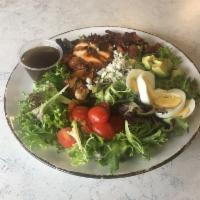 Smoked Chicken Cobb Salad · Mixed greens, smoked chicken, bacon, boiled egg, avocado, tomatoes, blue cheese. 