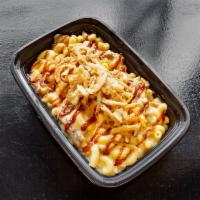 Mac and Oink · Cheddar cheese sauce, shredded pork belly, cottage bacon, and bacon bits, topped with shredd...