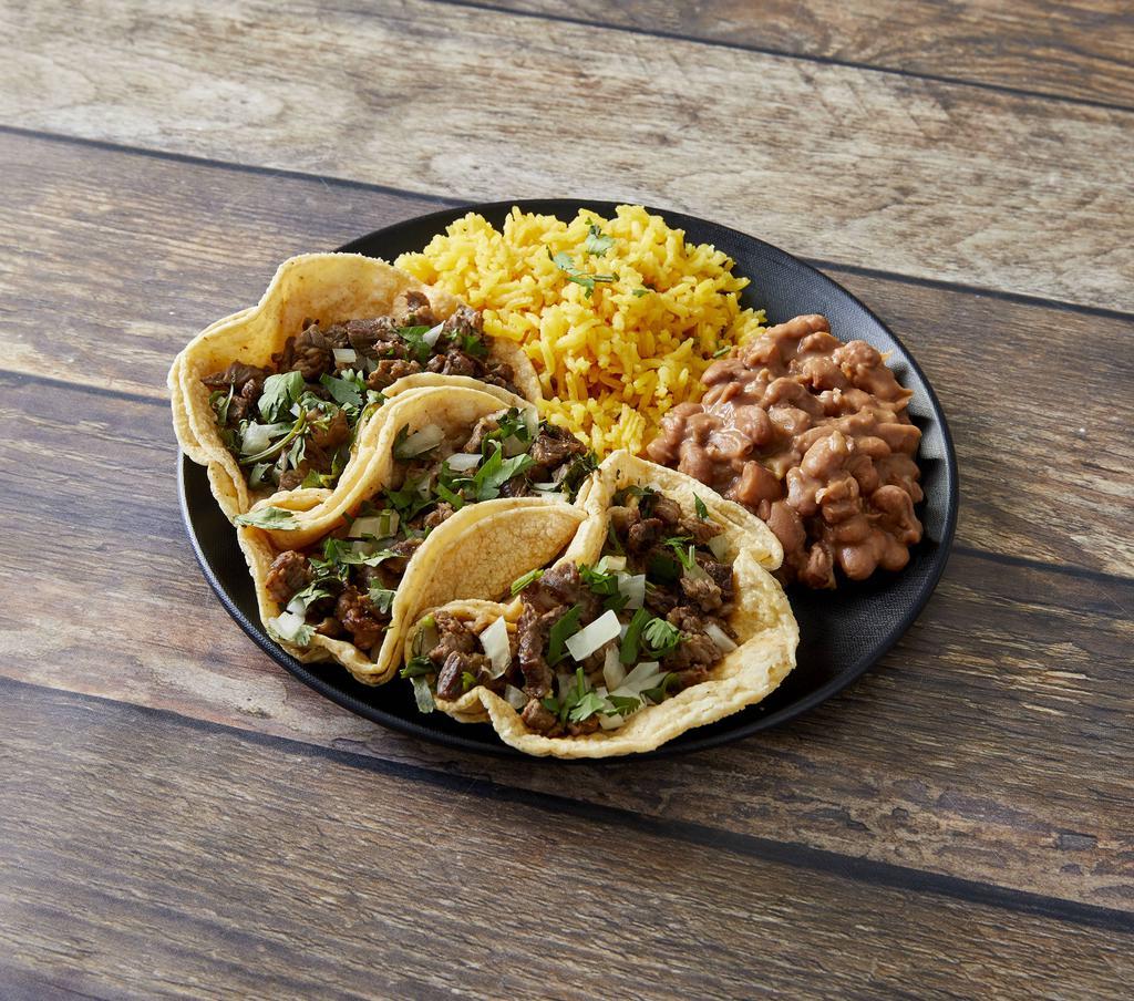 Taco Dinner · Three tacos with steak or chicken. Served with rice, refried beans and your choice of corn or flour tortillas.