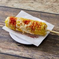 Sweet Corn Ala Mexicana · Sweet corn steamed served with sweet butter, mayo, cotija cheese and chile powder.