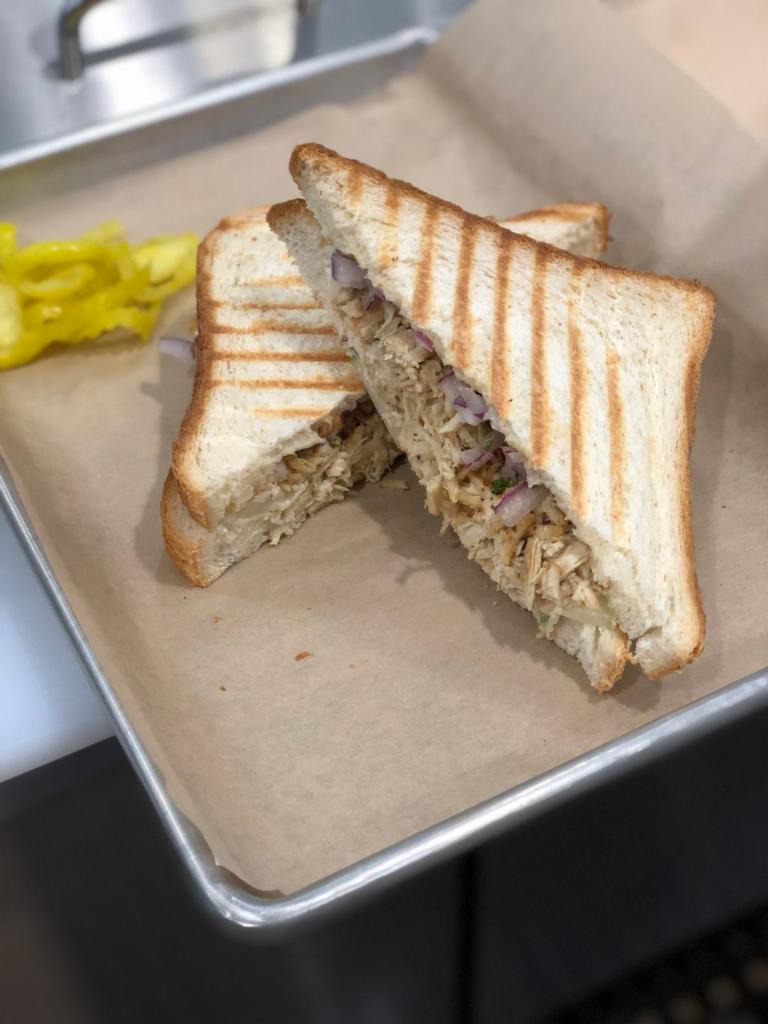 Mojo Pulled Chicken Sandwich · White or wheat toast with pulled mojo chicken, white onions, Greek yogurt with chunky cucumbers fresh mint and lemon juice.