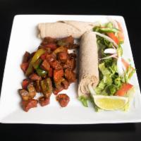 Chicken Tibs · Breast chicken, onions, tomatoes, jalapenos and fresh herbs. Served with choice of bread.