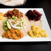 Veggie Combo · Split pea, lentils, collard greens and cabbage. Served with choice of bread.