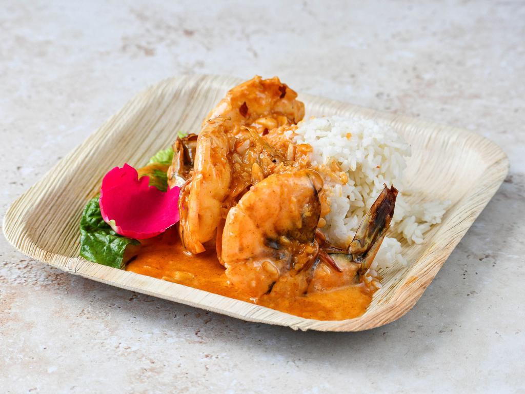 ISLAND GARLIC PRAWNS (Halabos Hipon Bawang) · Large prawns cooked in buttery creamy garlic goodness served over jasmine rice served with side of pickled okra.
