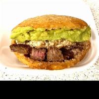 Corn Bread Arepa with Steak and cheese · Is Big and Delicious