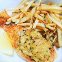 Stuffed Salmon · Fresh Wild Salmon stuffed with crab cake. served with fresh cut fries and a side of your cho...