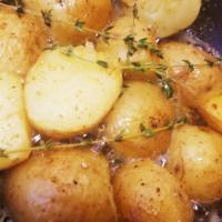 Roasted Mini Potatoes · Roasted Mini Potatoes in garlic, fresh herbs and olive oil.