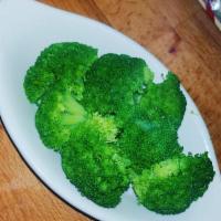 Broccoli · Steamed Broccoli tossed in butter and a splash of lemon.