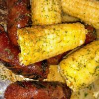 Sausage and Corn · Flame grilled beef sausage and sweet corn with cajun butter sauce.