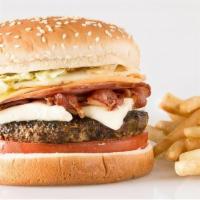 Hamburguesa La Full Equipo · 7 oz. burger, white cheese, bacon, ham, yellow American cheese, egg, potato chips, cabbage, ...
