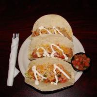 Rasta Chicken Tacos · Lettuce, tomato, Colby Jack cheese and lime crema with salsa on the side.