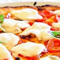 Margarita Pizza · Pizza sauce, fresh mozzarella, aroma tomato, fresh basil drizzled with extra virgin olive oil.