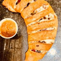 Hunger Buster Calzone · Pizza sauce, pepperoni, sausage, green pepper, onions, mushroom, black olives and mozzarella...