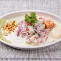 Ceviche Mixto · Fresh seafood marinated with lime juice. Served with sweet potato and topped with red onions.