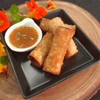 House-made Lumpia Shanghai · Pork filled eggrolls. Served with sweet chile-garlic sauce.